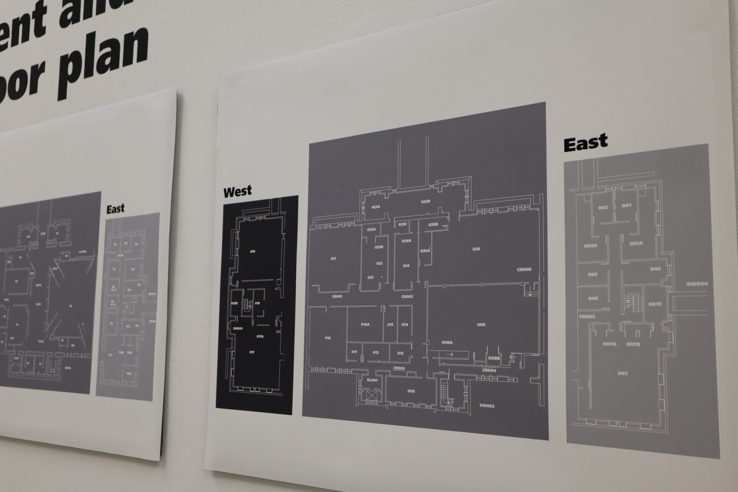Kehinde Osho with directional signage panel